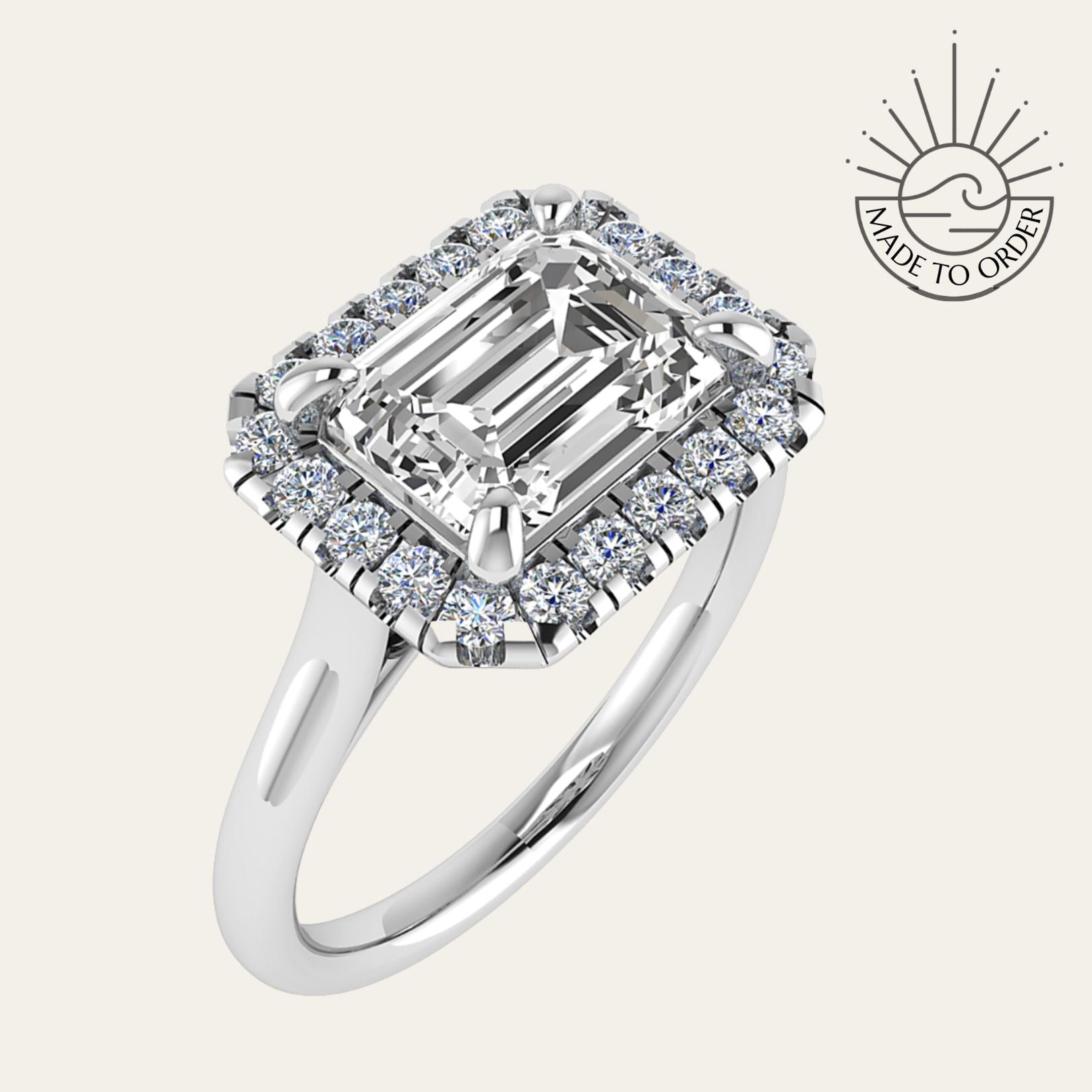 white gold engagement ring, emerald cut diamond ring, halo engagement ring, handmade wedding ring, ethical diamond ring, modern bridal jewelry, geometric engagement ring, handcrafted England ring, sustainable wedding band, anniversary gift, luxury engagement ring, contemporary bridal ring, elegant diamond ring