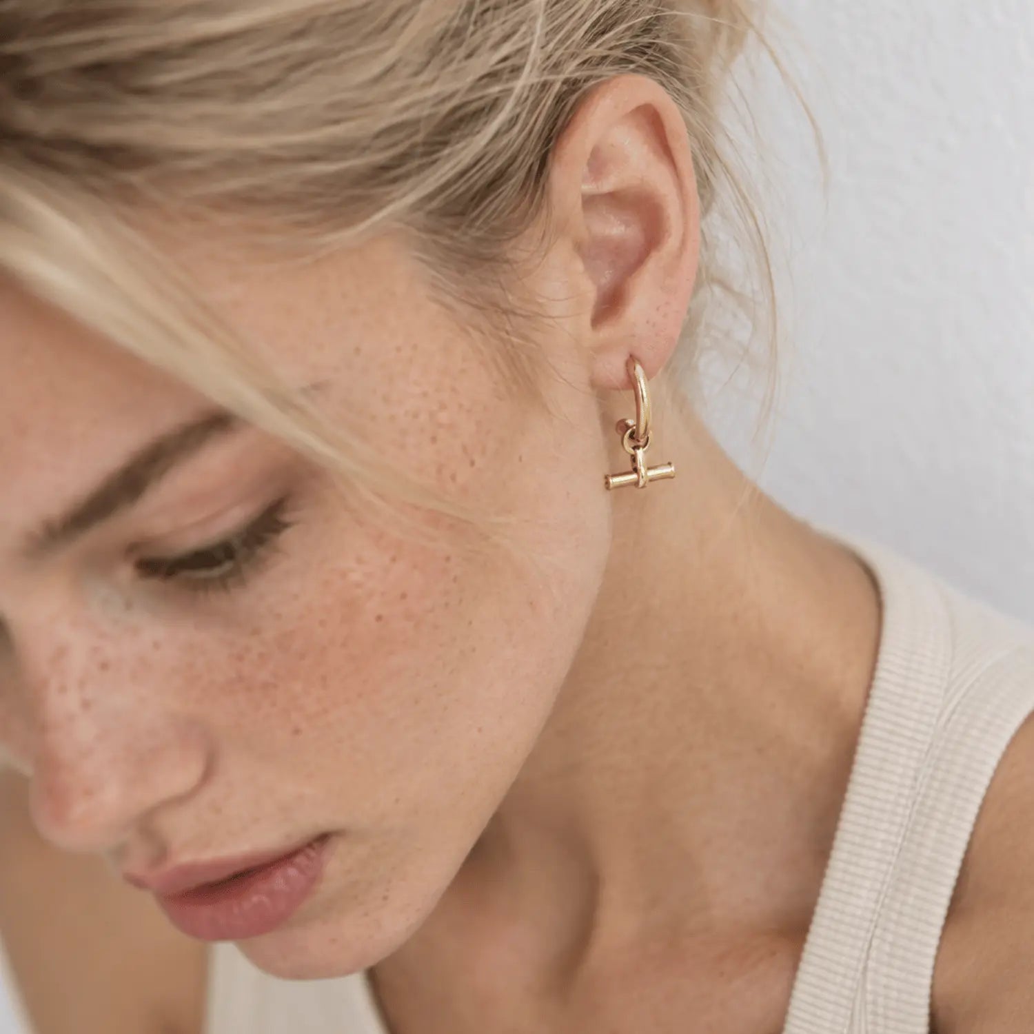 Shop T Bar Half Hoop Stud Earrings in gold vermeil or sterling silver. Minimal, handmade and perfect for everyday wear or layering. Free UK delivery over £75.