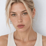 Shop T Bar Half Hoop Stud Earrings in gold vermeil or sterling silver. Minimal, handmade and perfect for everyday wear or layering. Free UK delivery over £75.