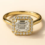 18ct gold engagement ring, emerald cut diamond ring, halo engagement ring, handmade wedding ring, ethical diamond ring, modern bridal jewelry, geometric engagement ring, handcrafted England ring, sustainable wedding band, anniversary gift, luxury engagement ring, contemporary bridal ring, elegant diamond ring