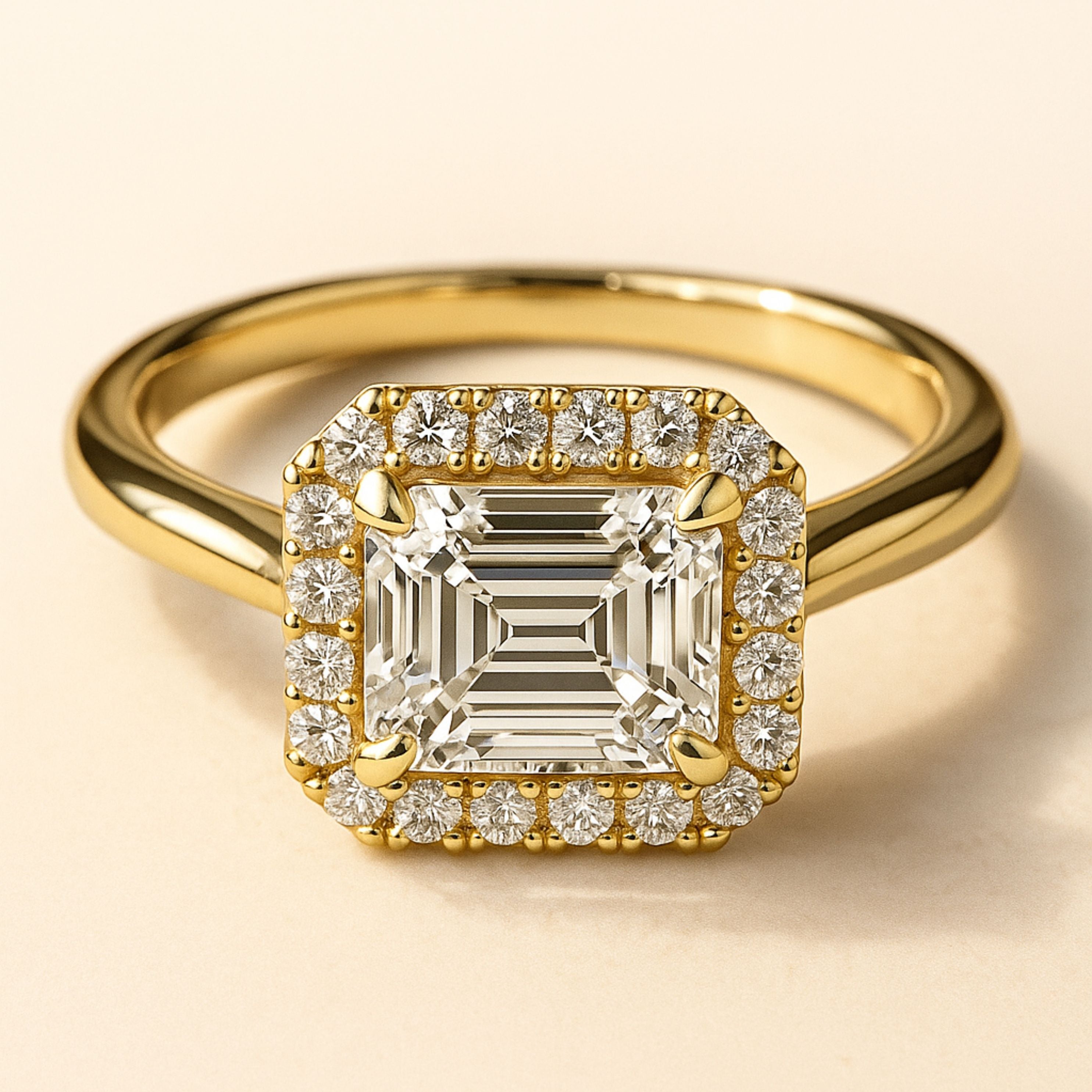 18ct gold engagement ring, emerald cut diamond ring, halo engagement ring, handmade wedding ring, ethical diamond ring, modern bridal jewelry, geometric engagement ring, handcrafted England ring, sustainable wedding band, anniversary gift, luxury engagement ring, contemporary bridal ring, elegant diamond ring