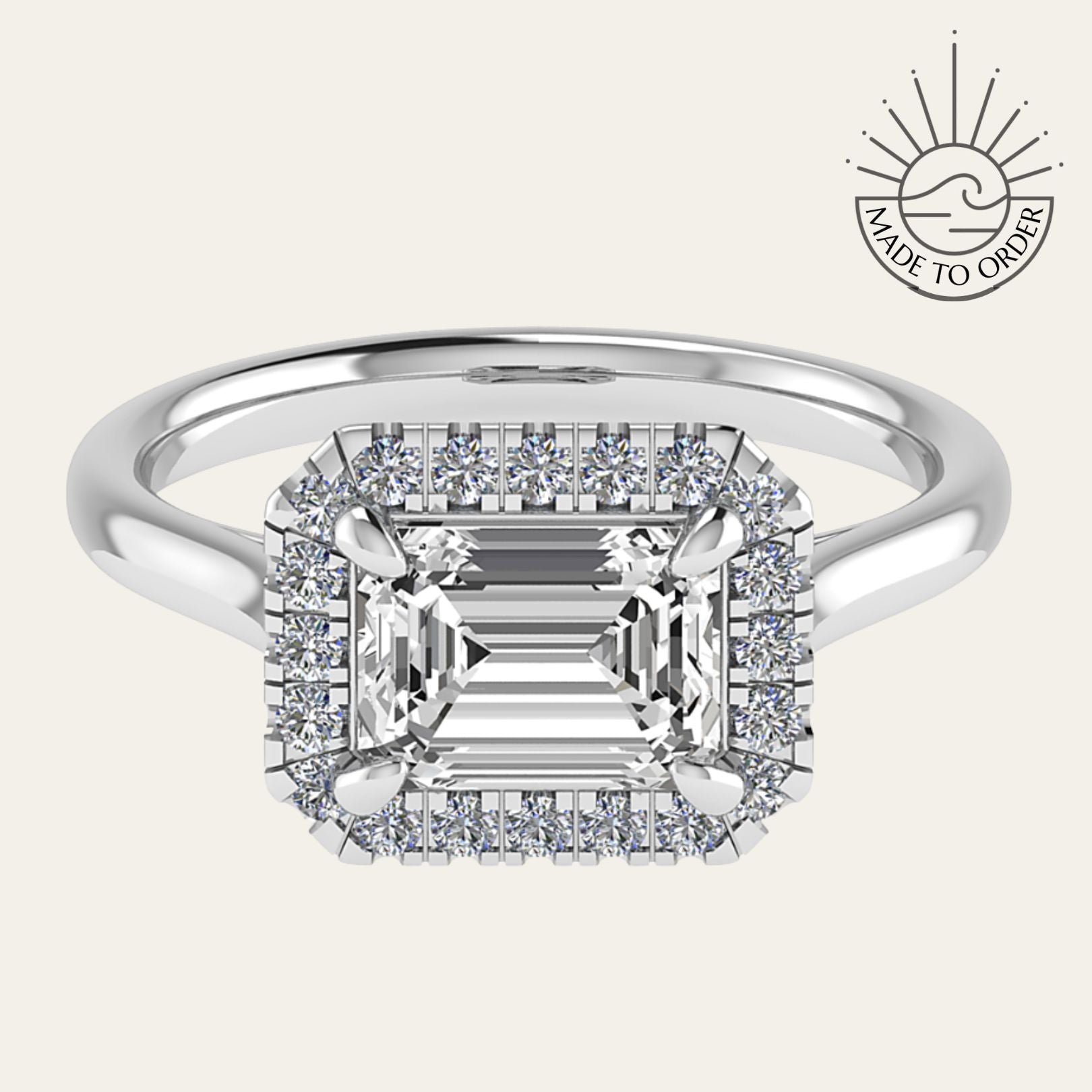 white gold engagement ring, emerald cut diamond ring, halo engagement ring, handmade wedding ring, ethical diamond ring, modern bridal jewelry, geometric engagement ring, handcrafted England ring, sustainable wedding band, anniversary gift, luxury engagement ring, contemporary bridal ring, elegant diamond ring