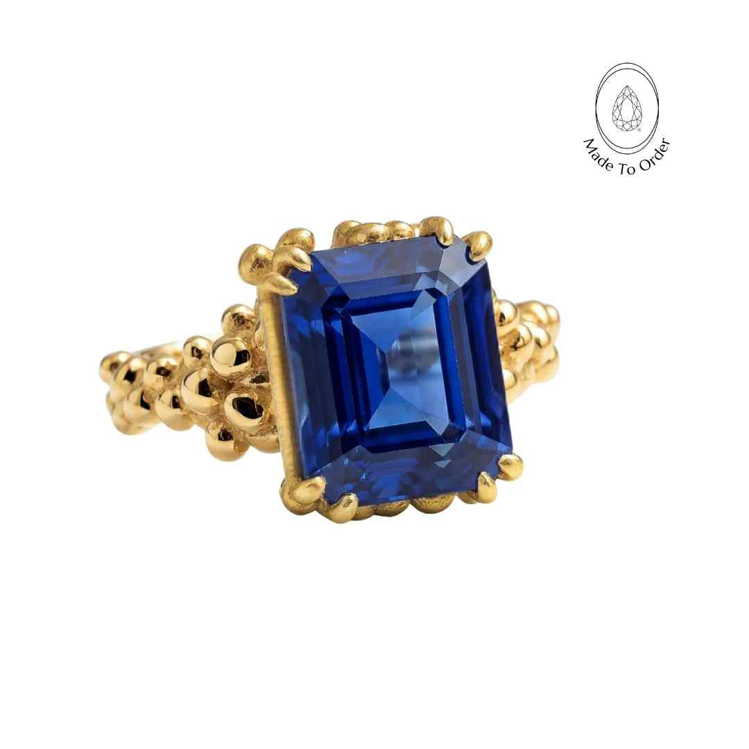 sapphire cocktail ring, eco-friendly jewellery, ocean inspired ring, sustainable sapphire ring, deep blue gemstone, handmade Sapphire jewellry, octagonal sapphire ring, eco-conscious gift, ocean theme jewelry, British craftsmanship, unique statement ring, bold cocktail ring, gift for her