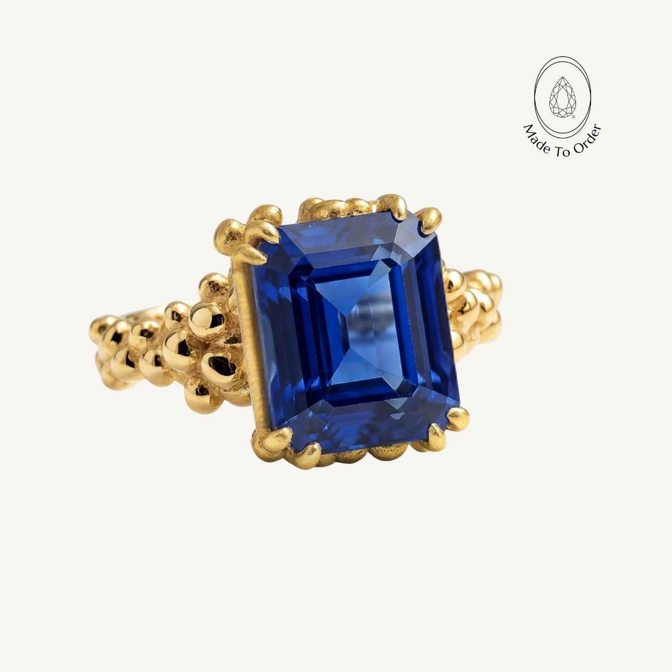 sapphire cocktail ring, eco-friendly jewellery, ocean inspired ring, sustainable sapphire ring, deep blue gemstone, handmade Sapphire jewellry, octagonal sapphire ring, eco-conscious gift, ocean theme jewelry, British craftsmanship, unique statement ring, bold cocktail ring, gift for her
