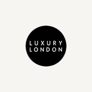Black circle with 'Luxury London' text on a white background