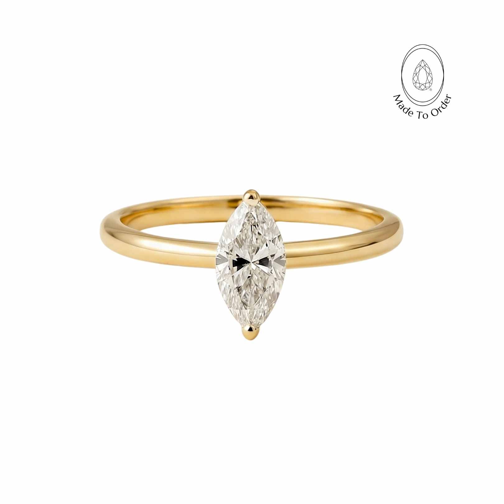 gold diamond ring, water inspired jewellery, engagement ring women, anniversary gift jewellery, delicate diamond band, marquise diamond ring, handmade solid gold ring, wedding jewelry, elegant statement ring, luxury solitaire diamond, special occasion gift, modern engagement ring, gemstone anniversary ring