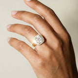platinum diamond ring, gold cushion halo ring, engagement statement ring, luxury diamond jewelry, heirloom engagement ring, 4 carat diamond ring, modern diamond ring, special occasion jewelry, sustainable engagement ring, princess cut halo, anniversary gift jewelry, bridal ring, ethical diamond ring