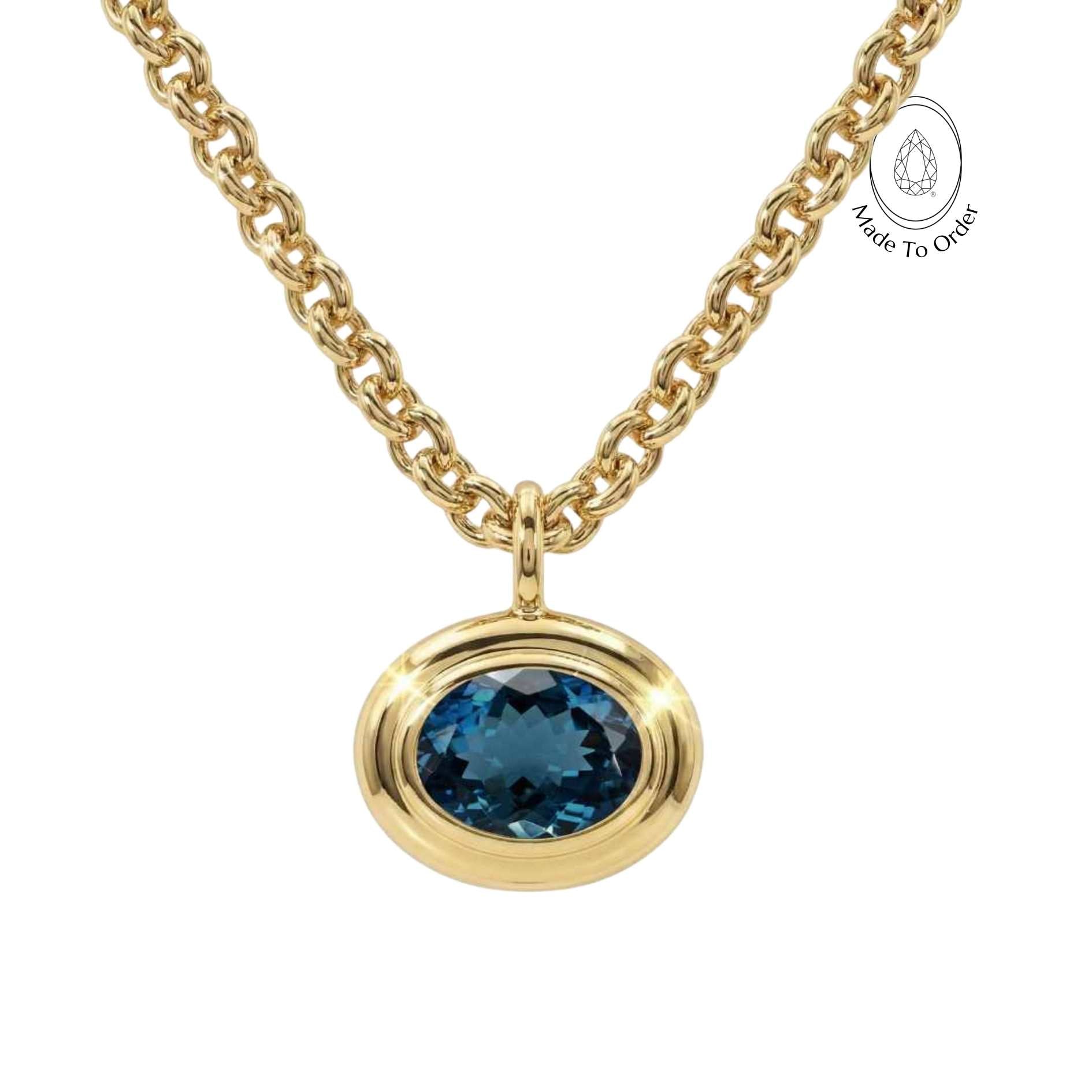 london blue topaz necklace, gold gemstone jewelry, statement gold necklace, ethical jewelry gift, blue topaz pendant, layered gold necklace, minimalist statement jewelry, birthday gift for her, luxury jewelry piece, boho chic necklace, handmade gold jewelry, ocean inspired jewelry, special occasion gift