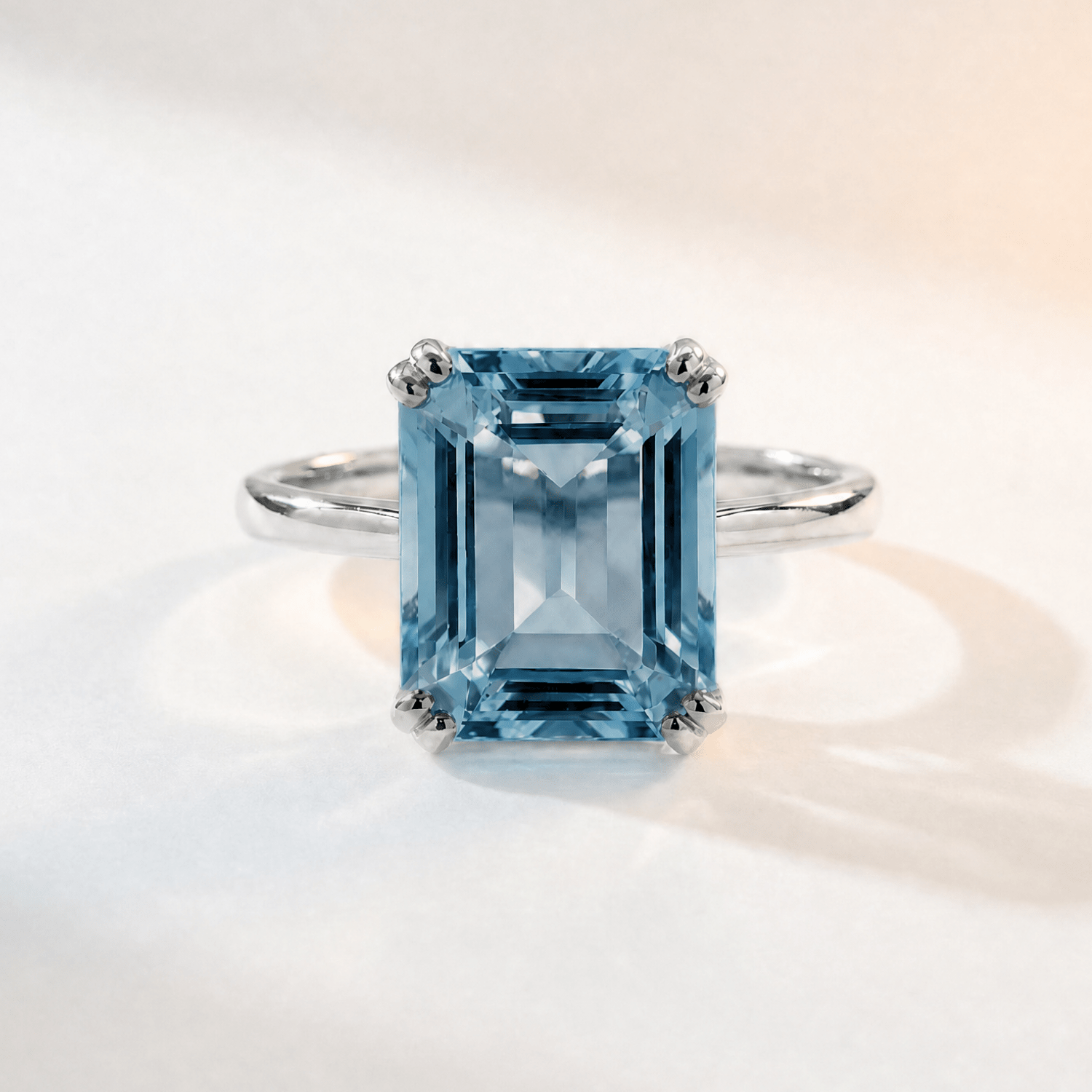 Ring with a large blue gemstone on a white background