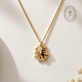 Solid 9ct yellow gold limpet seashell necklace with 1.5cm pendant on an 18 inch chain, handcrafted coastal fine jewellery by Dainty London