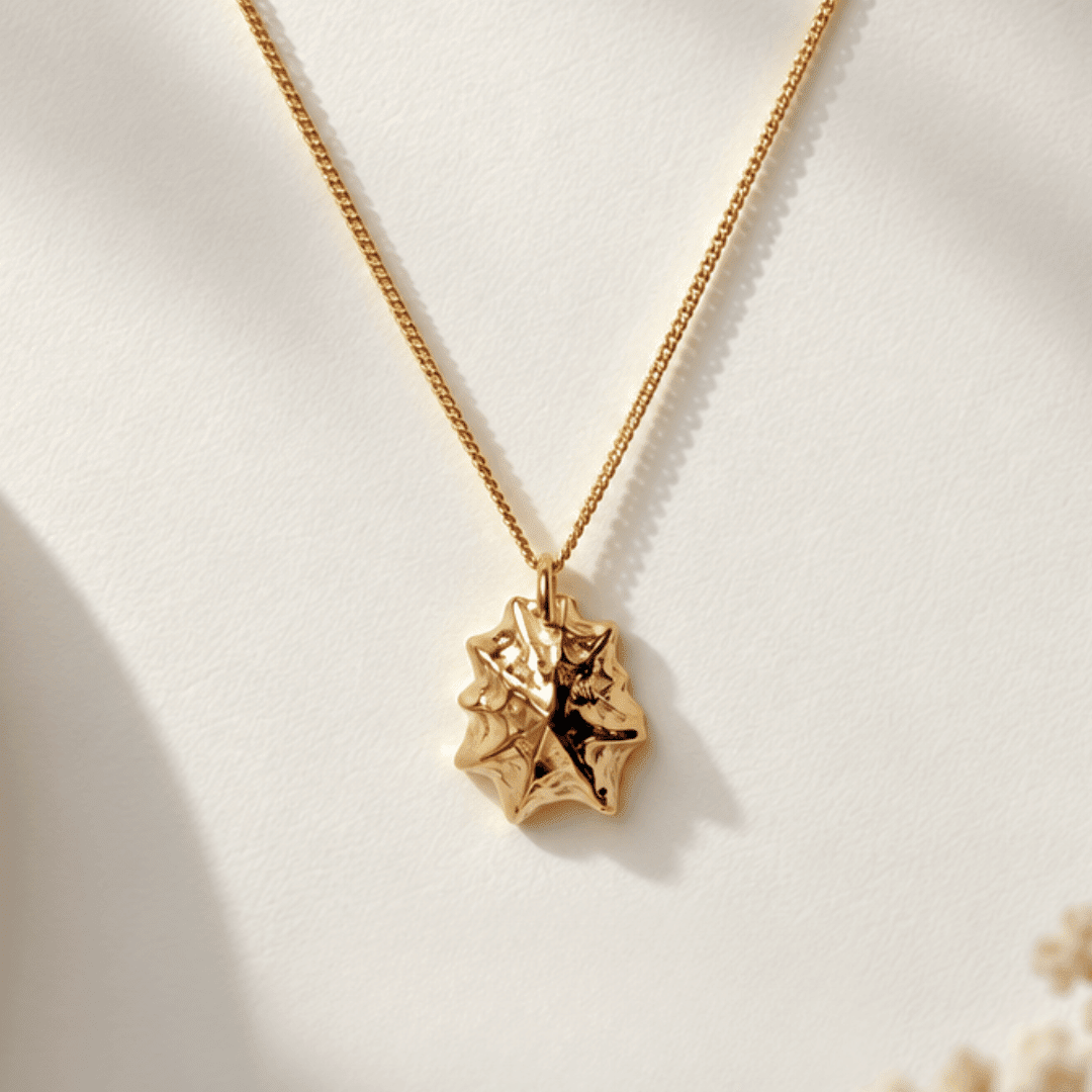 Solid 9ct yellow gold limpet seashell necklace with 1.5cm pendant on an 18 inch chain, handcrafted coastal fine jewellery by Dainty London