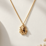 Solid 9ct yellow gold limpet seashell necklace with 1.5cm pendant on an 18 inch chain, handcrafted coastal fine jewellery by Dainty London