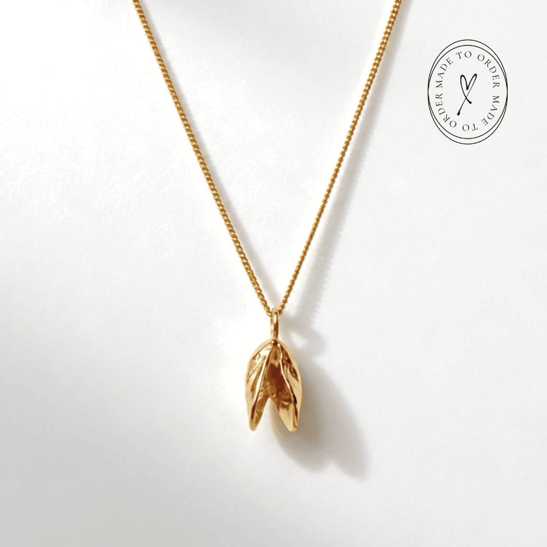 Solid 9ct yellow gold mussel seashell necklace with 1.5cm pendant on an 18 inch chain, handcrafted coastal fine jewellery by Dainty London