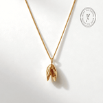 Solid 9ct yellow gold mussel seashell necklace with 1.5cm pendant on an 18 inch chain, handcrafted coastal fine jewellery by Dainty London