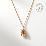 Solid 9ct yellow gold mussel seashell necklace with 1.5cm pendant on an 18 inch chain, handcrafted coastal fine jewellery by Dainty London