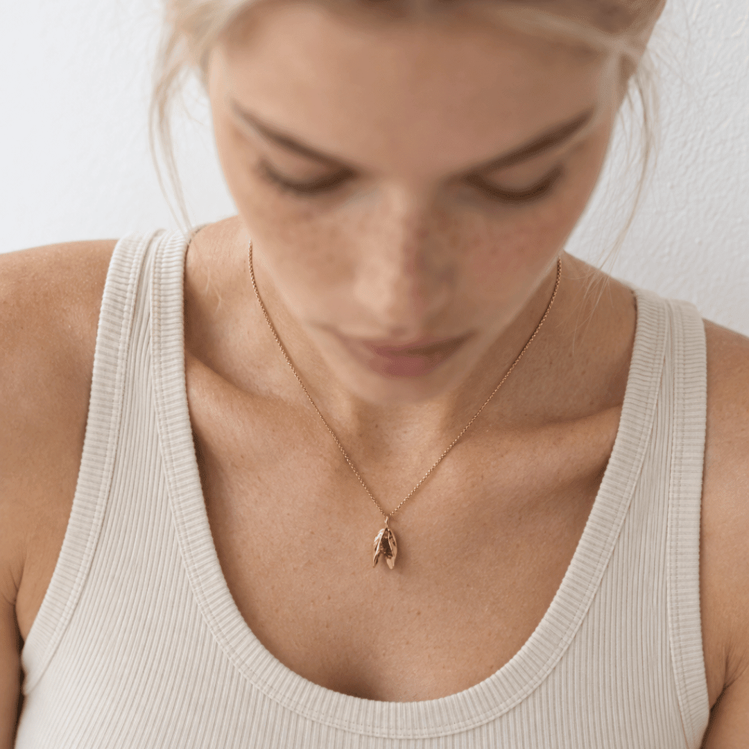 Solid 9ct yellow gold mussel seashell necklace with 1.5cm pendant on an 18 inch chain, handcrafted coastal fine jewellery by Dainty London
