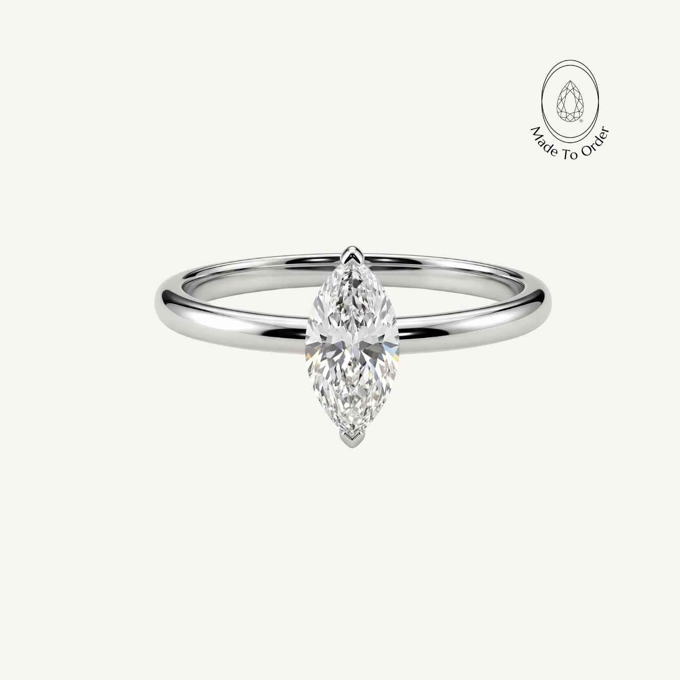 Platinum Marquise Diamond Ring - The Marlowe Ring - Dainty London platinum diamond ring, water inspired jewellery, engagement ring women, anniversary gift jewellery, delicate diamond band, marquise diamond ring, handmade platinum ring, wedding jewelry, elegant statement ring, luxury solitaire diamond, special occasion gift, modern engagement ring, gemstone anniversary ring