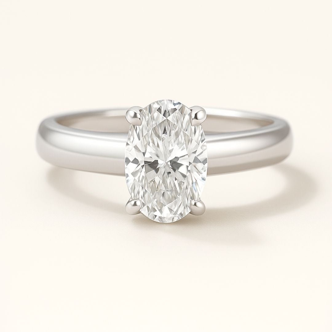 Platinum Oval Diamond Ring - The Isolde Ring - Dainty London platinum oval diamond ring, ethical lab-grown diamond, modern engagement ring, GIA certified diamond, luxury promise ring, contemporary anniversary jewellery, sustainable fine jewellry, oval cut diamond ring, ethical engagement gift, handcrafted diamond ring, timeless woman’s ring, special occasion jewelry, elegant promise ring