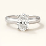 Platinum Oval Diamond Ring - The Isolde Ring - Dainty London platinum oval diamond ring, ethical lab-grown diamond, modern engagement ring, GIA certified diamond, luxury promise ring, contemporary anniversary jewellery, sustainable fine jewellry, oval cut diamond ring, ethical engagement gift, handcrafted diamond ring, timeless woman’s ring, special occasion jewelry, elegant promise ring