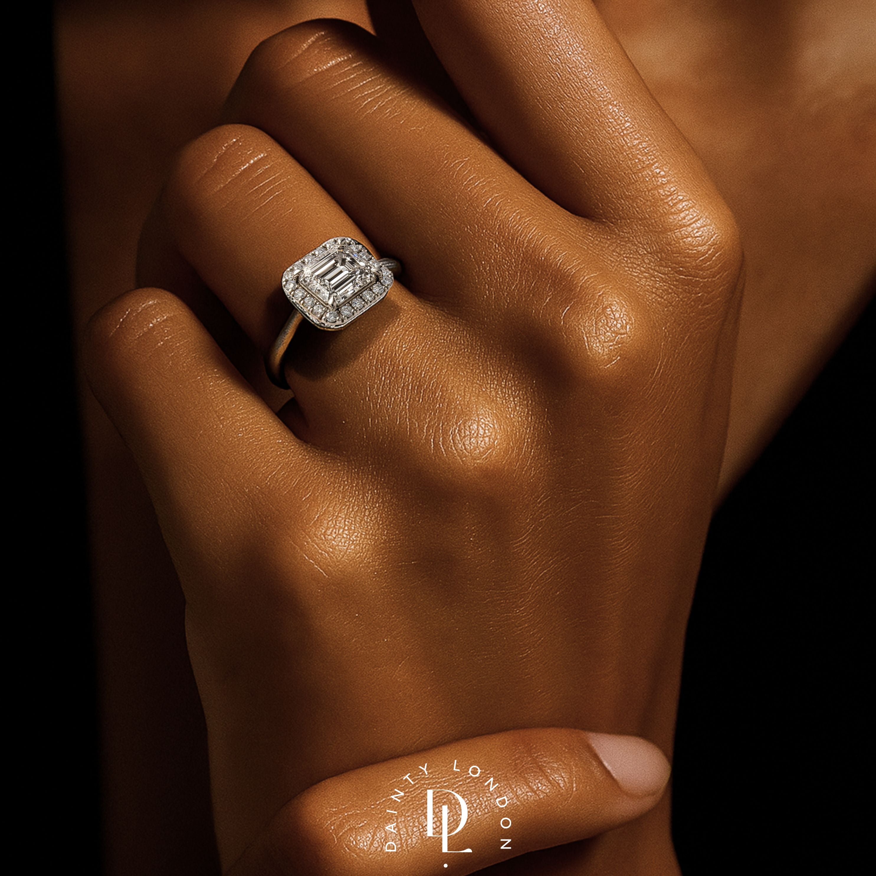 white gold engagement ring, emerald cut diamond ring, halo engagement ring, handmade wedding ring, ethical diamond ring, modern bridal jewelry, geometric engagement ring, handcrafted England ring, sustainable wedding band, anniversary gift, luxury engagement ring, contemporary bridal ring, elegant diamond ring
