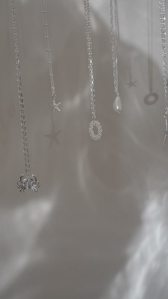 beach jewellery, starfish necklace, ocean charm, nautical jewellery, sea lover gift, sterling silver necklace, nature inspired jewelry, seaside accessory, coastal jewelry, beach gift for her, handcrafted sea charm, summer jewelry, ocean lover gift