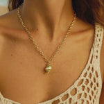 sea inspired jewelry, ocean necklace, gold seashell necklace, coastal jewelry gift, beach lover gift, layered gold necklace, nautical jewelry, statement beach necklace, fairtrade gold jewelry, gift for her, handmade ocean jewelry, beach vacation accessory, ocean themed gift