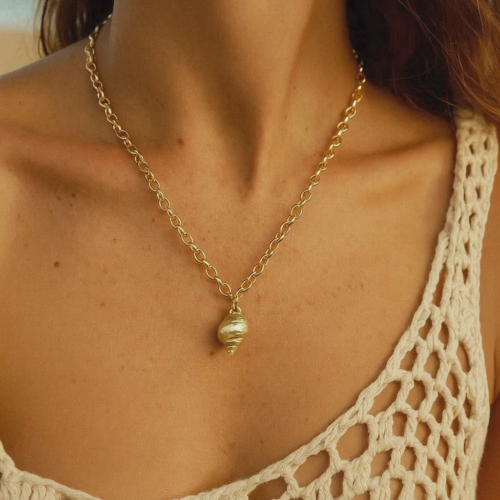 sea inspired jewelry, ocean necklace, gold seashell necklace, coastal jewelry gift, beach lover gift, layered gold necklace, nautical jewelry, statement beach necklace, fairtrade gold jewelry, gift for her, handmade ocean jewelry, beach vacation accessory, ocean themed gift