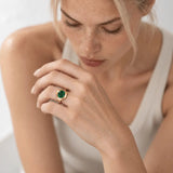 Sylvie solid 9ct gold green emerald ring with 10x8mm oval cut stone and granulation detail, handcrafted luxury fine jewellery by Dainty London