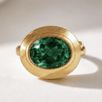 Sylvie solid 9ct gold green emerald ring with 10x8mm oval cut stone and granulation detail, handcrafted luxury fine jewellery by Dainty London