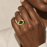 Sylvie solid 9ct gold green emerald ring with 10x8mm oval cut stone and granulation detail, handcrafted luxury fine jewellery by Dainty London