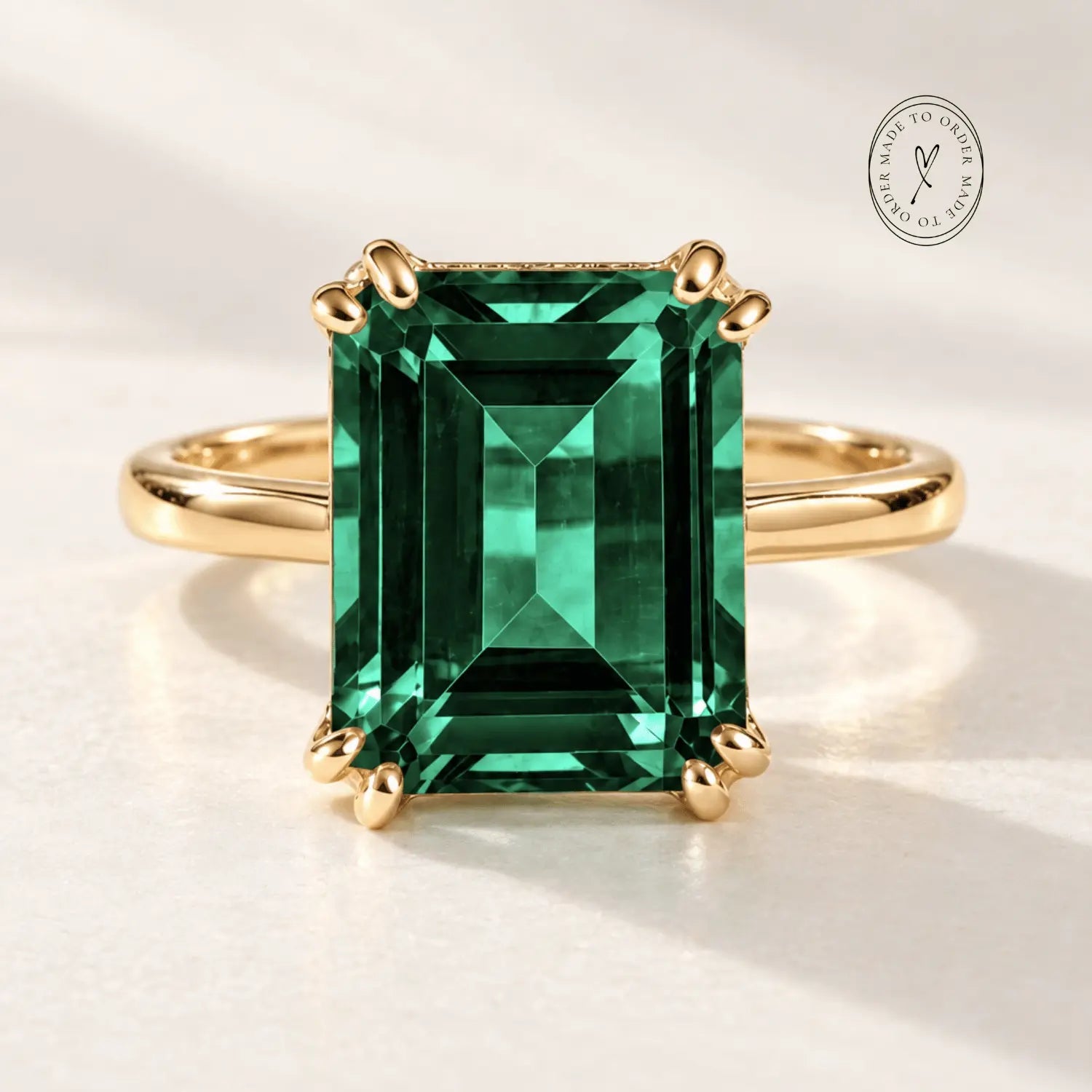 Elara green emerald ring in solid 9ct gold with an 11x9mm octagonal Hydrothermal Emerald gemstone, handcrafted by Dainty London