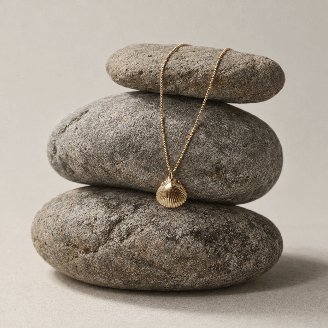 Solid Gold Seashell Necklace for Lovers of the Sea - Dainty London gold seashell necklace, coastal jewelry, ocean pendant, nature inspired jewelry, Cornwall seaside gift, beach lover gift, mermaid jewelry, ocean lover necklace, handmade coastal jewelry, star charm necklace, sustainable jewelry, beach cottage style, meaningful coastal gift