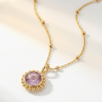 Sunburst necklace with a glowing light purple amethyst, barnacle-textured bezel detail. Ocean-inspired statement jewellery. Selfridges Style Birthday Gifts