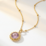 Sunburst necklace with a glowing light purple amethyst, barnacle-textured bezel detail. Ocean-inspired statement jewellery. Selfridges Style Birthday Gifts