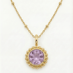 Sunburst necklace with a glowing light purple amethyst, barnacle-textured bezel detail. Ocean-inspired statement jewellery. Selfridges Style Birthday Gifts