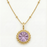 Sunburst necklace with a glowing light purple amethyst, barnacle-textured bezel detail. Ocean-inspired statement jewellery. Selfridges Style Birthday Gifts