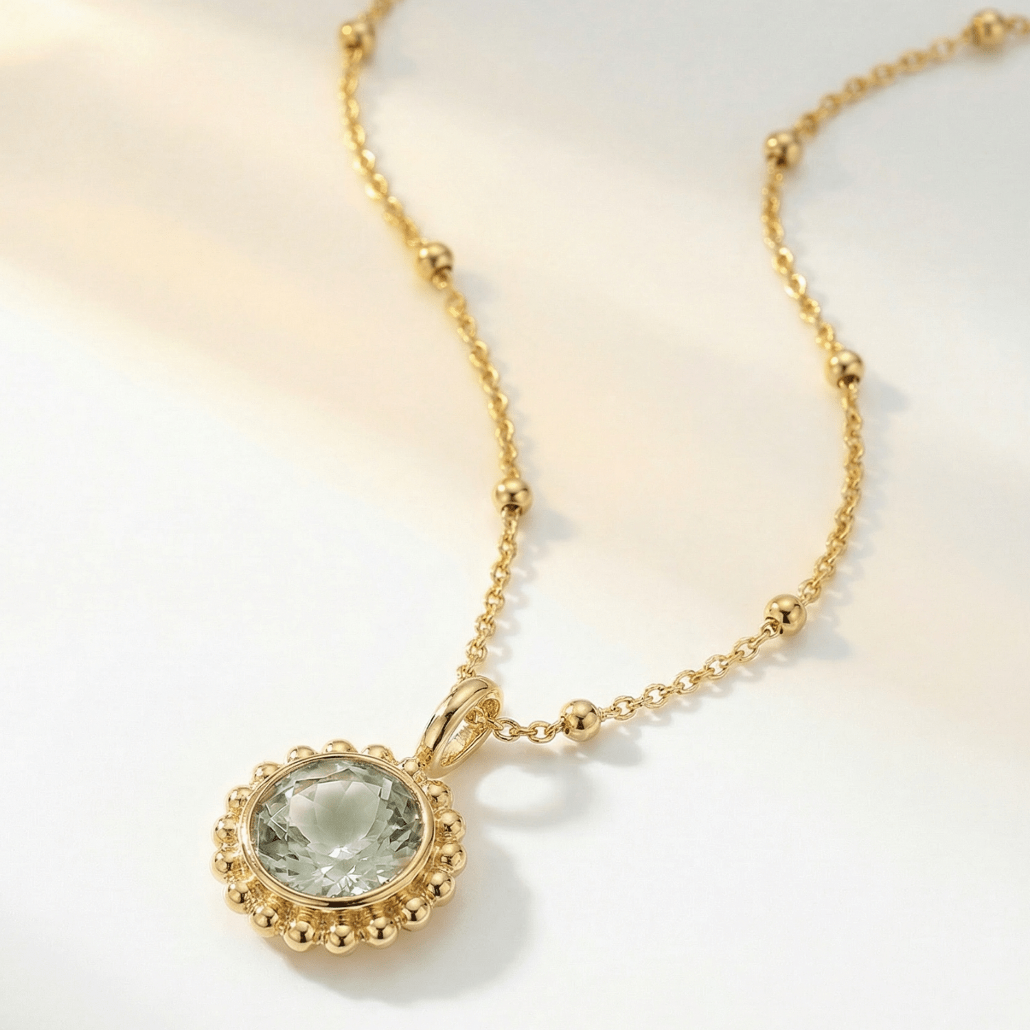 Sunburst necklace with a green quartz, barnacle-textured bezel detail. Ocean-inspired statement jewellery with coastal charm. Alex Monroe Style Birthday Gifts For Her