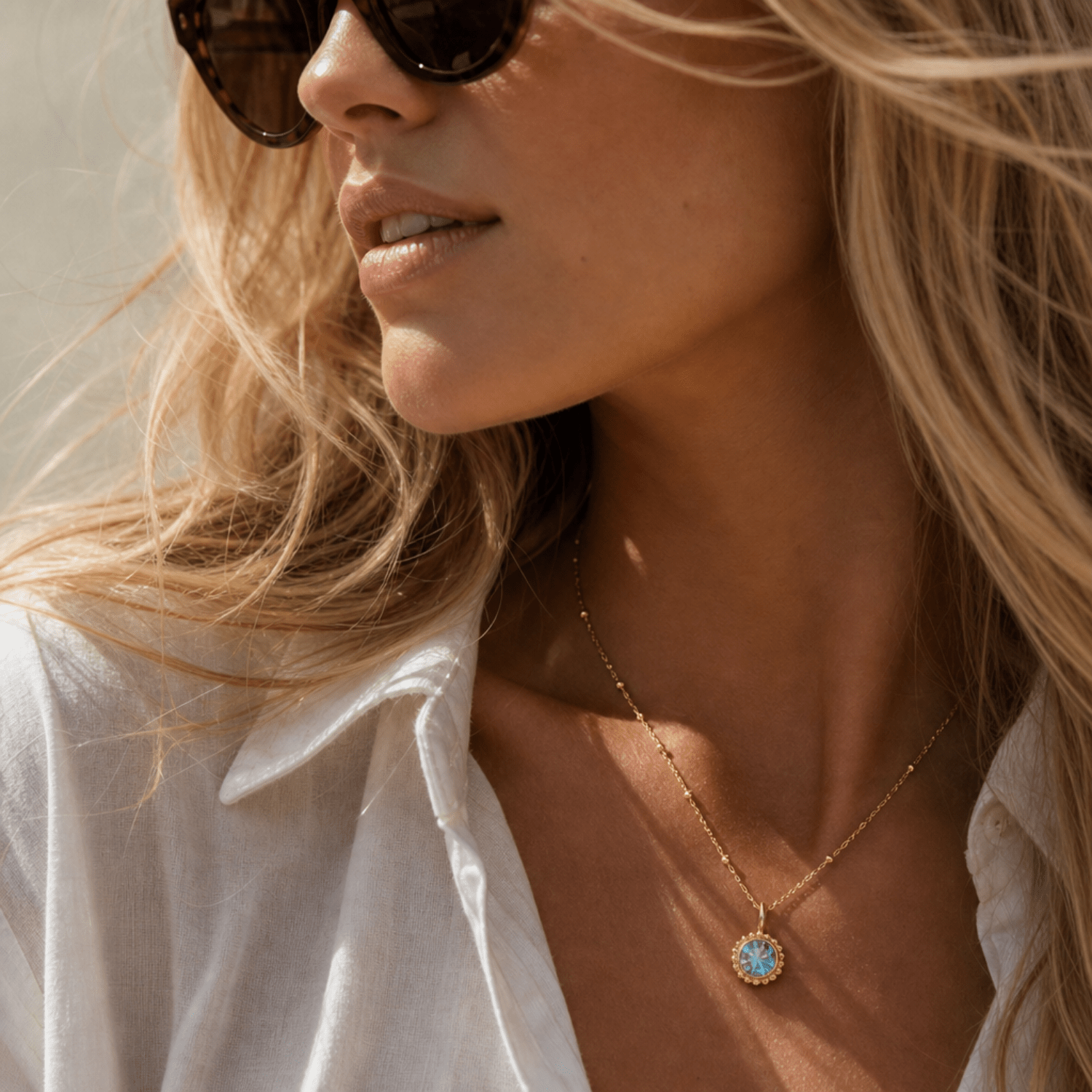 Sunburst necklace with a sparkling sky blue topaz. Ocean-inspired statement jewellery with coastal charm. Monica Vinader-Style jewellery, Birthday Gifts For Her