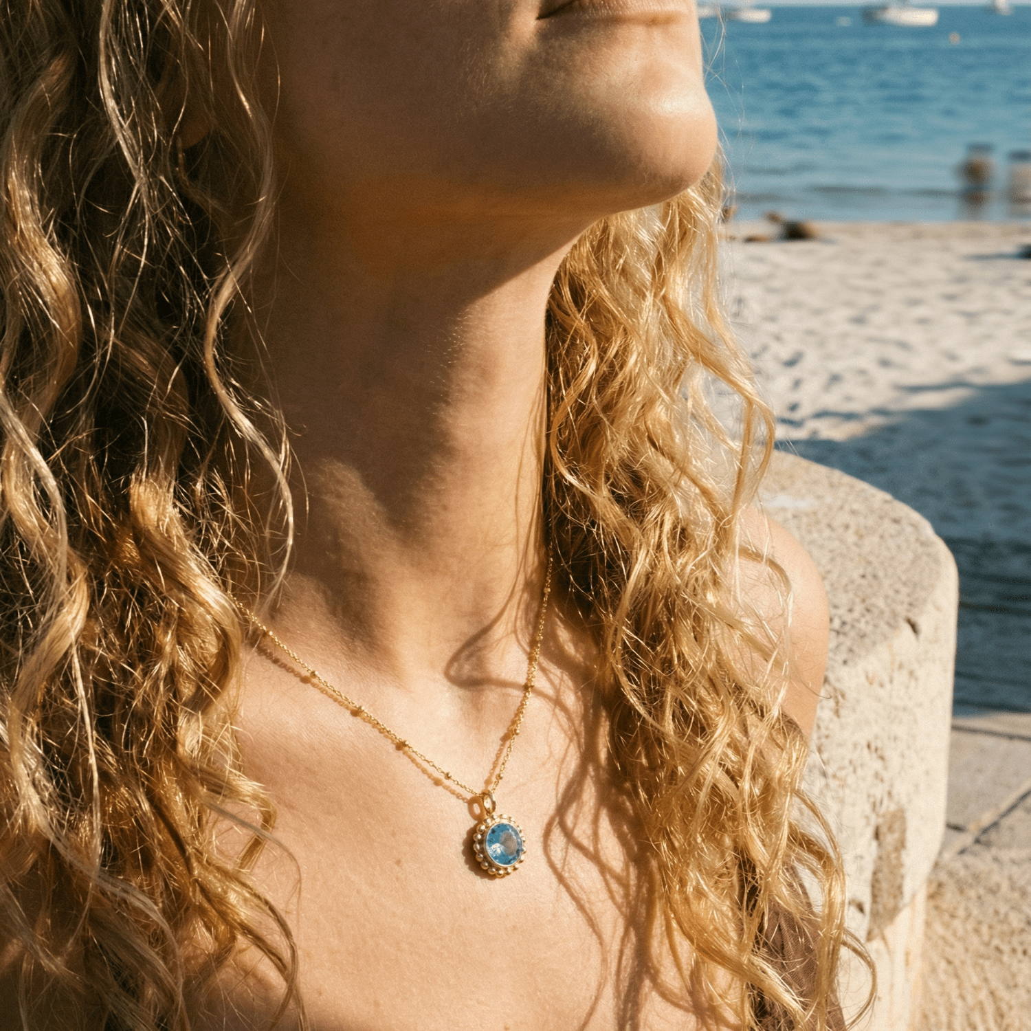 Sunburst necklace with a sparkling sky blue topaz. Ocean-inspired statement jewellery with coastal charm. Monica Vinader-Style jewellery, Birthday Gifts For Her