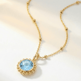 Sunburst necklace with a sparkling sky blue topaz. Ocean-inspired statement jewellery with coastal charm. Monica Vinader-Style jewellery, Birthday Gifts For Her